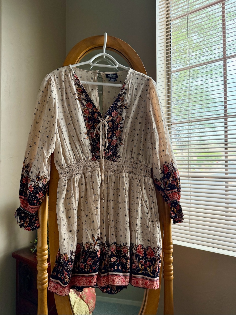 Angie Cream Romper with Black and Coral Floral Trim and Coral Accents